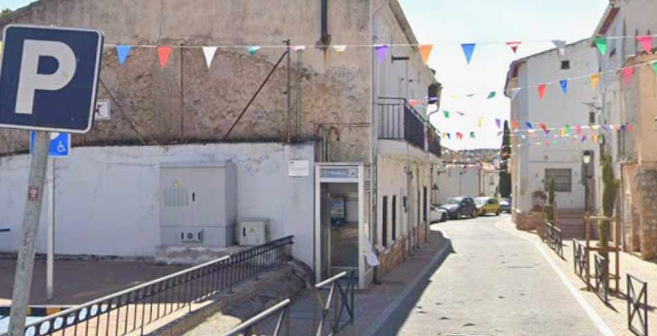 View of Calle Juan Carlos I, where one of the few telephone booths still to be found today is located.